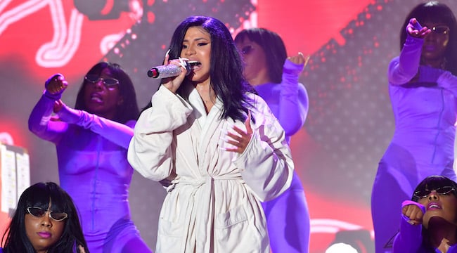 Cardi B Finished The Show In A Bathrobe After Tearing Her Costume On Stage.